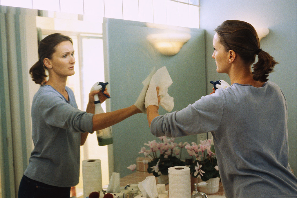 Woman cleaning the bathroom